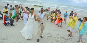Myrtle Beach Photographers at the Beach captures an aerial photo of newlyweds taking their first walk as husband and wife. Another beautiful Myrtle Beach wedding photo shoot.